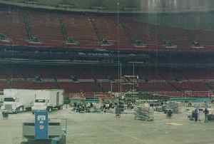 (Photo: the 
same, a short time later, with equipment being unloaded and scaffolding 
starting to go up)