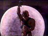 (He-Man standing with the moonlight behind him)